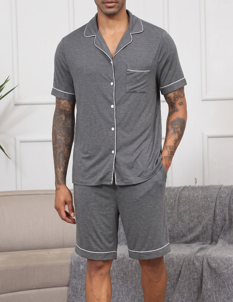 Men's dark grey notch-collar short-sleeve pajama set with button front and matching shorts.