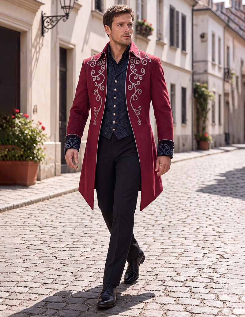 Men's burgundy embroidered tailcoat worn over black vest and white trousers, front view