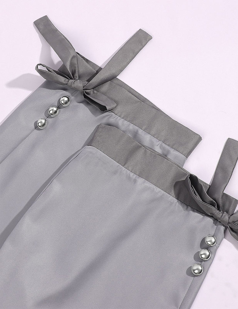 Gray suspender-style garment panels with silver buttons and bow-tied straps