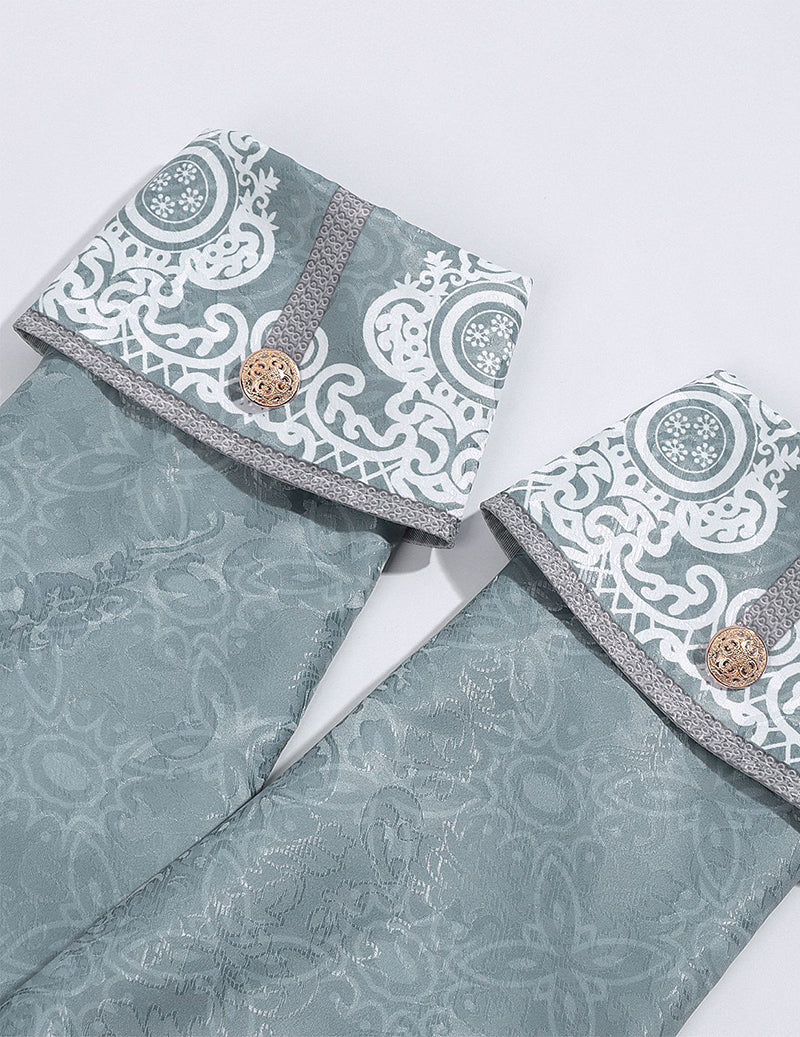 Light blue collar and coat fabric detail with ornate border and round button accent