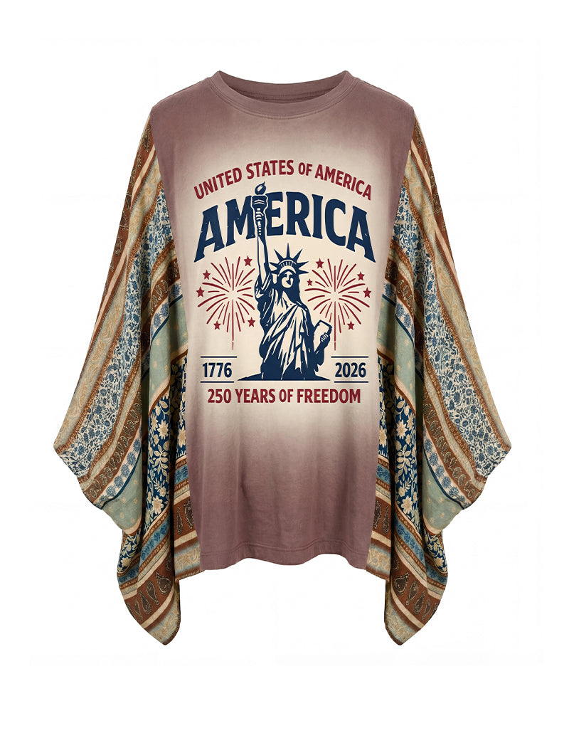 Mauve oversized graphic top with Statue of Liberty and fireworks; batwing sleeves patterned