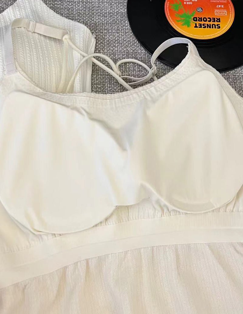 White adjustable spaghetti-strap camisole with ruched neckline and wide hem