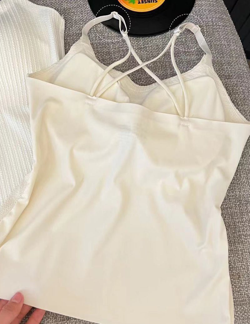 Cream adjustable spaghetti strap camisole with open back and crisscross strap detail