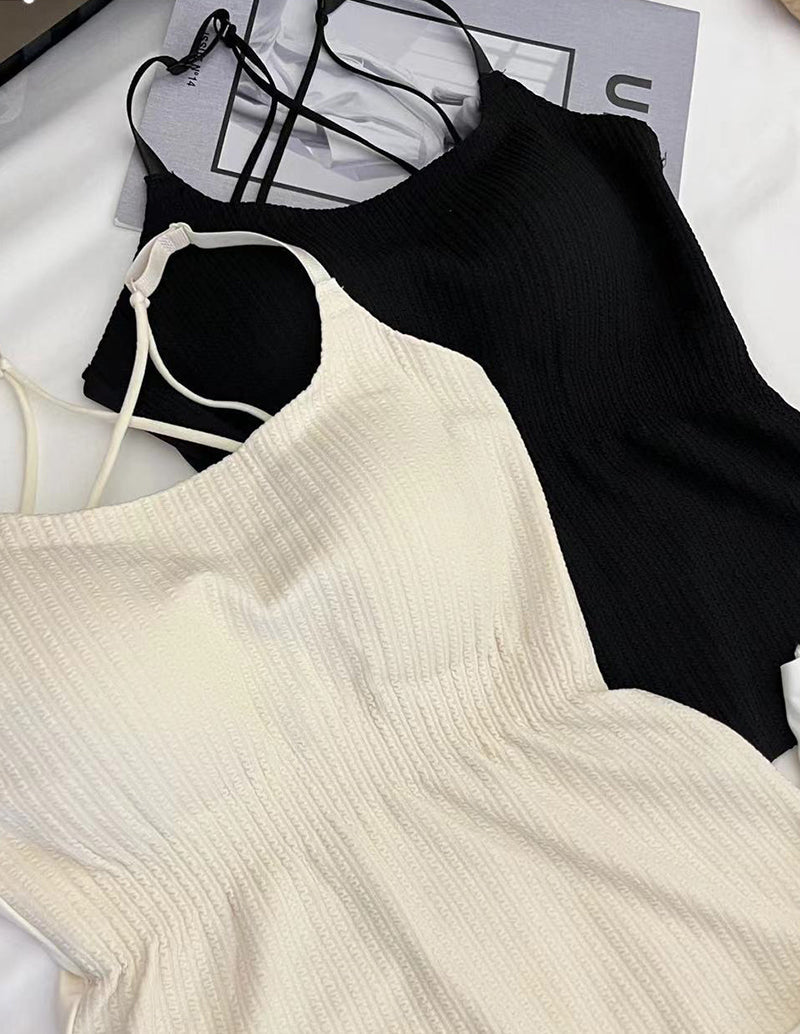 Cream and black adjustable spaghetti strap camisoles with textured knit fabric