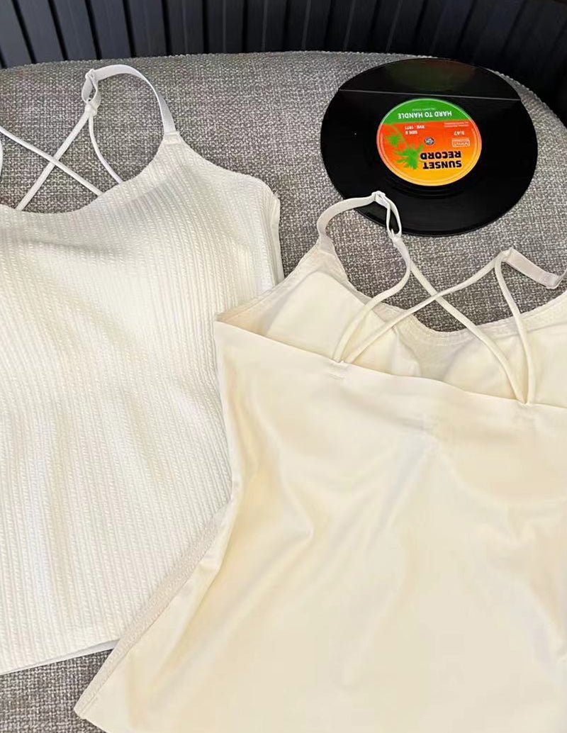 Light cream adjustable spaghetti strap camisole with open back and crisscross straps
