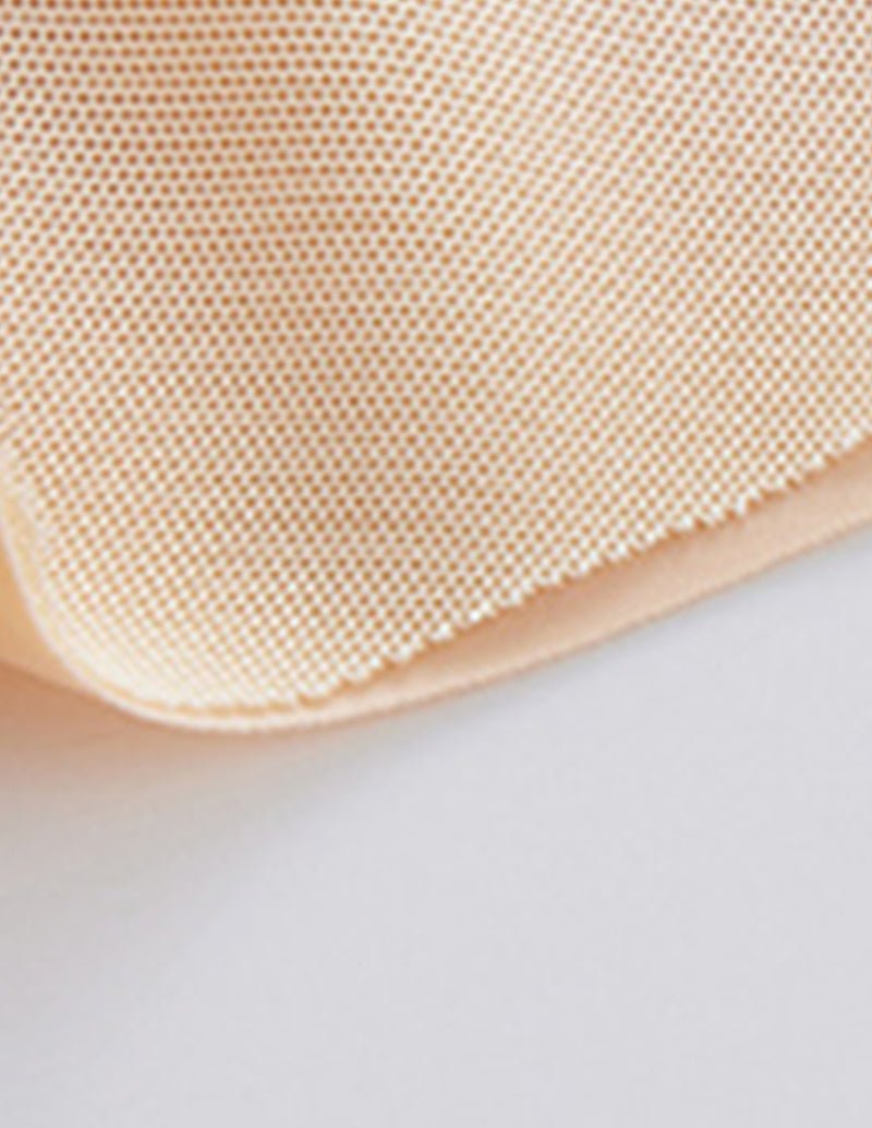 Beige shaper shorts with textured fabric leg hem and stitched edge trim