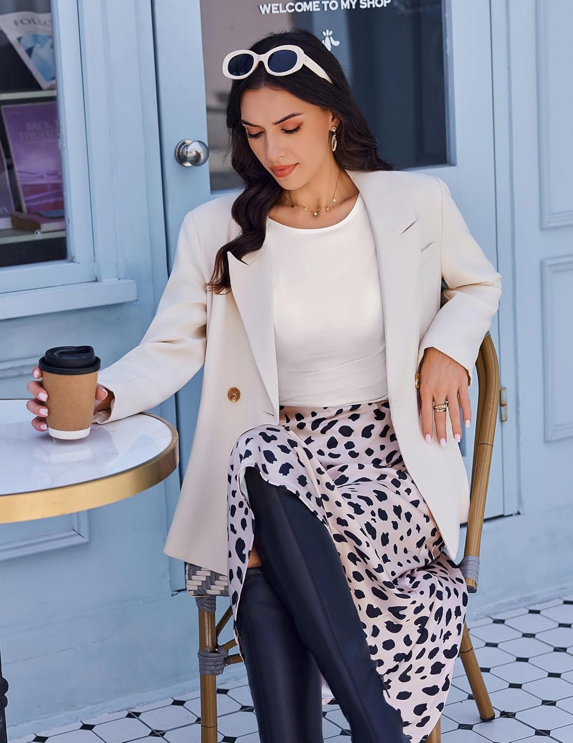 White boat neck ruched long sleeve top peeking under blazer