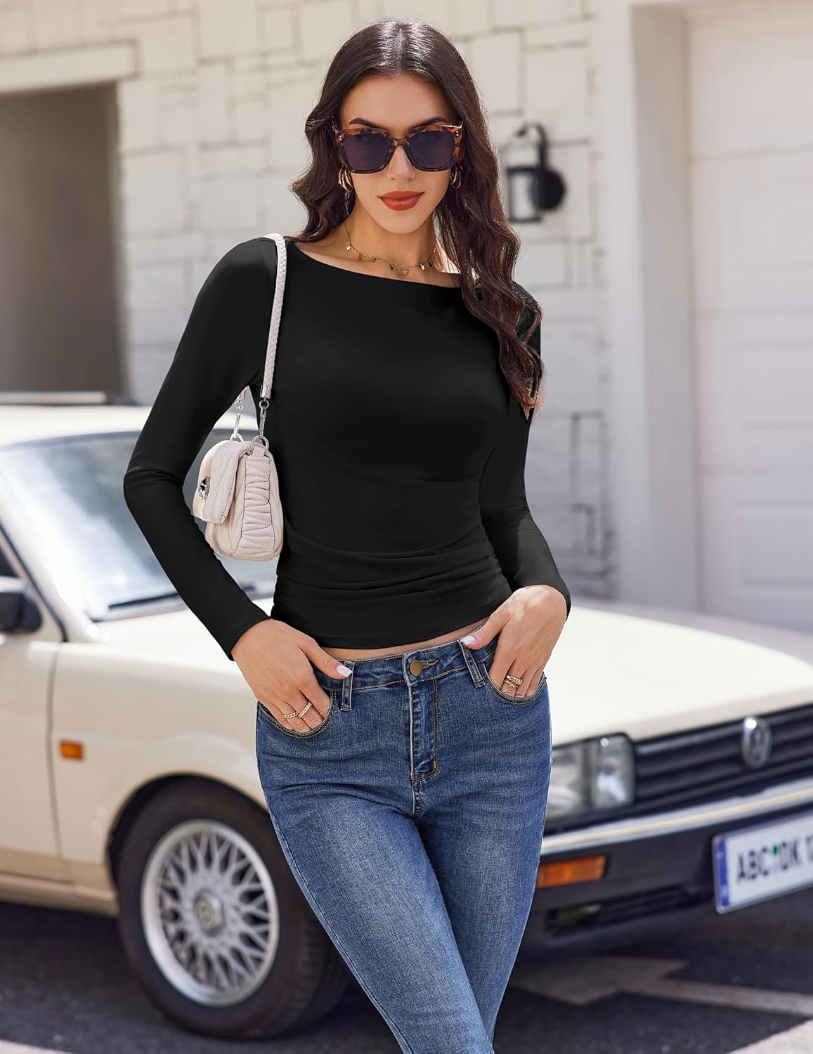 Black boat neck ruched long sleeve top with fitted waist ruching