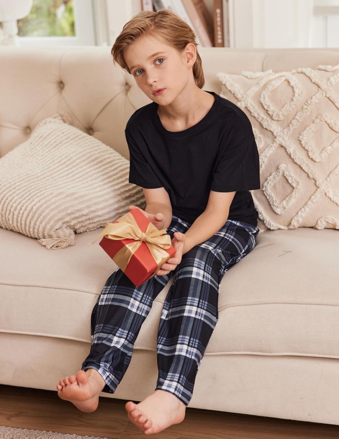 Boys blue and black plaid pajama pants with elastic waistband; long straight fit.