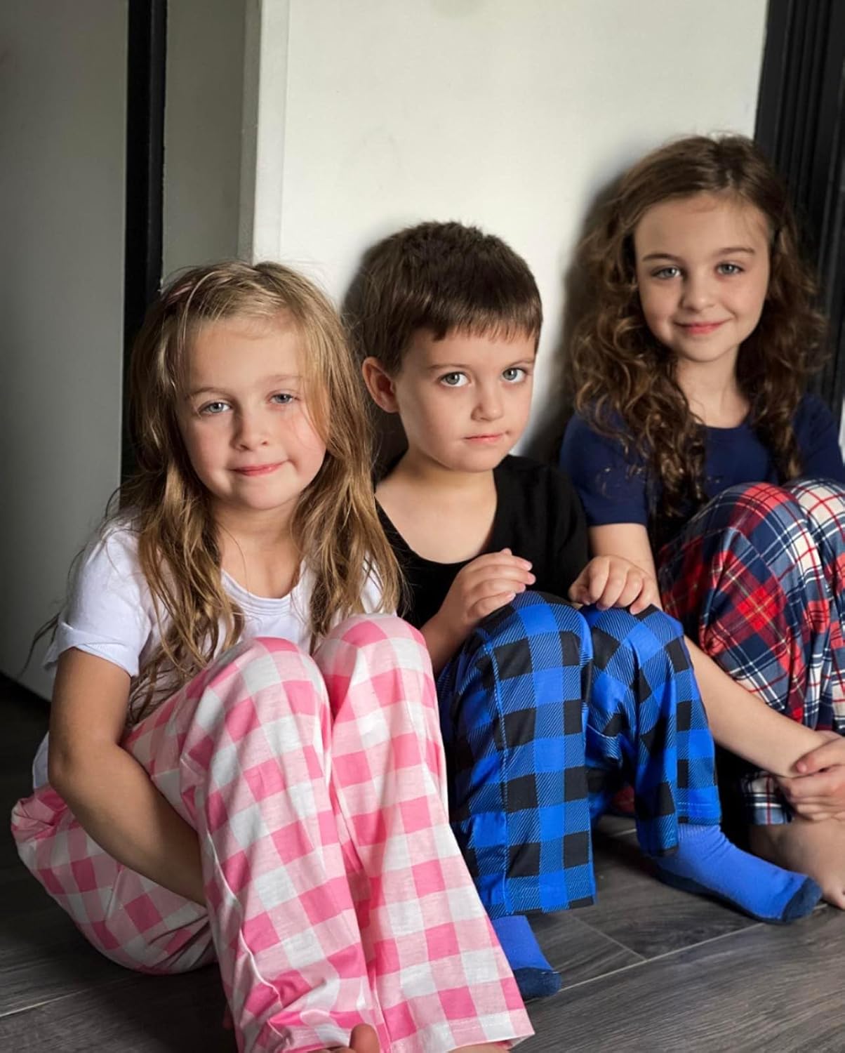 Plaid pyjama pants in blue, red, and white check with elastic waist