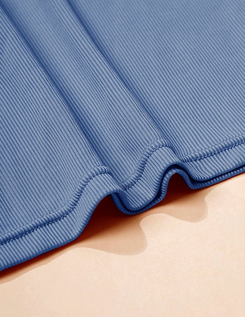 Blue ribbed stretchy camisole fabric with elastic hem edge close-up