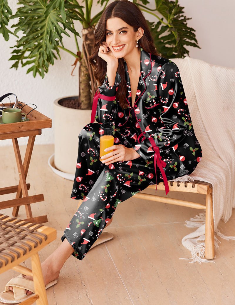 Black satin button-down pajama set with holiday print; long sleeves and pants