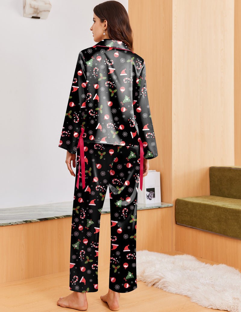 Black pajama set with festive holiday print, button-front top and long pants (back view)