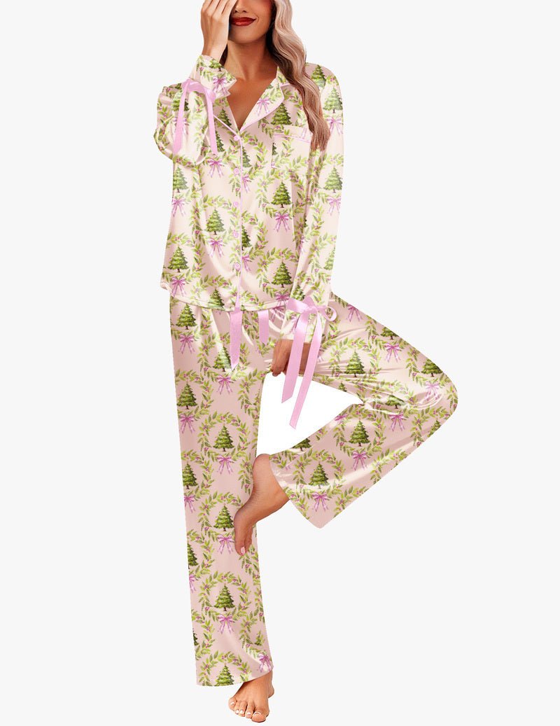 Light pink satin pajama set with evergreen tree and star print, button-down top
