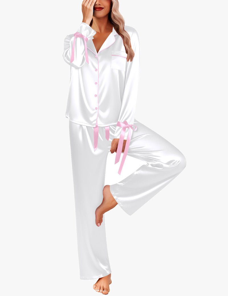 White satin button-down pajama set with pink ribbon tie, long sleeves and pants