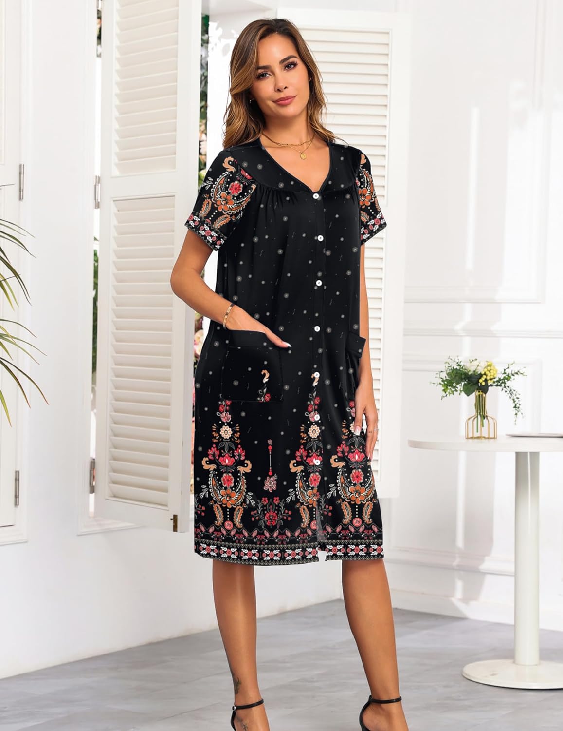 Black button-front nightgown dress with short sleeves and colorful floral hem panel