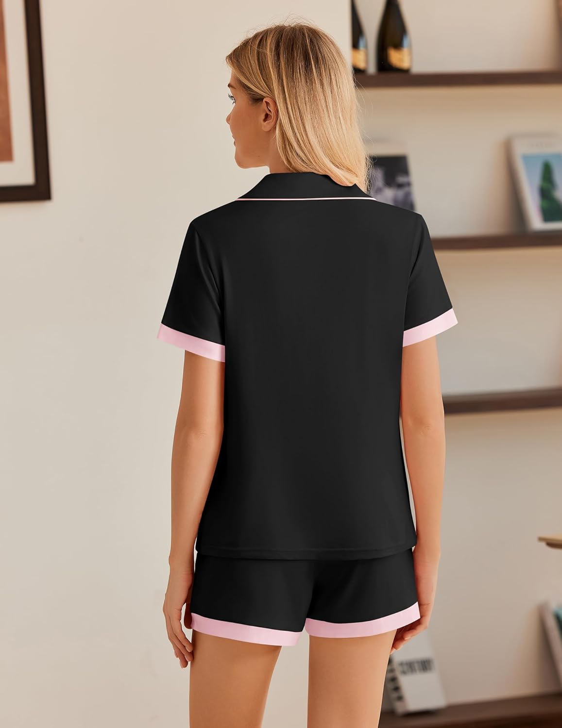 Black button-down pajama top and shorts set with pink trim detail