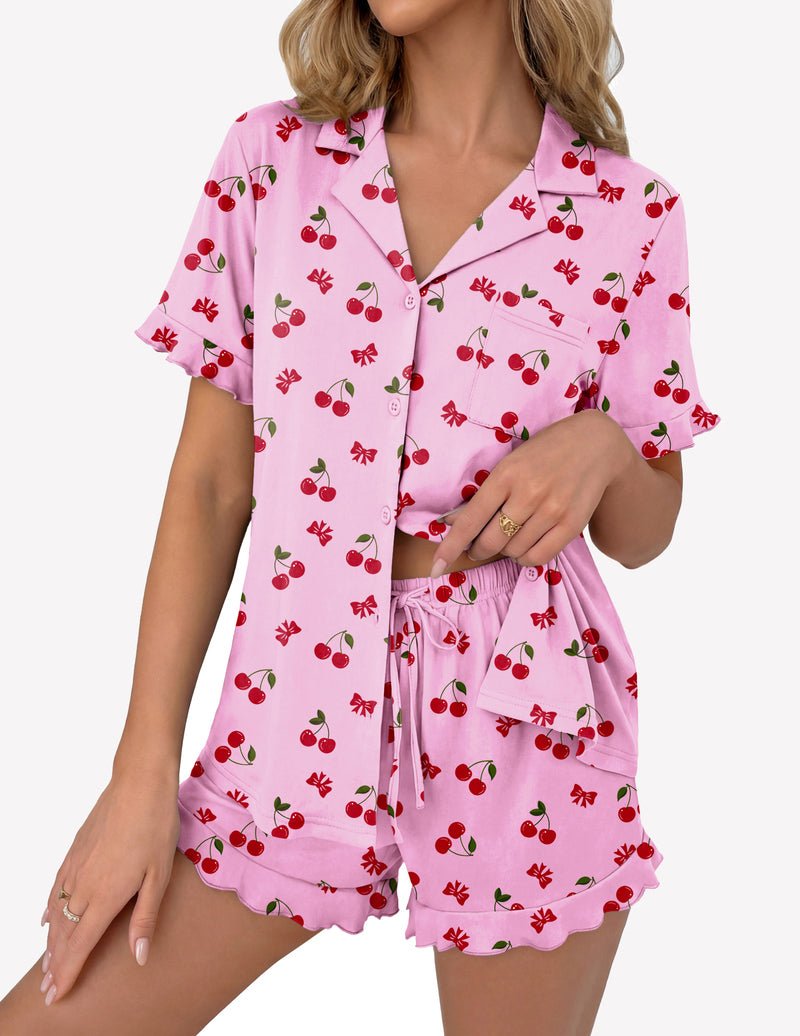 Pink pajama set with cherry print: button-up short sleeve top and drawstring shorts