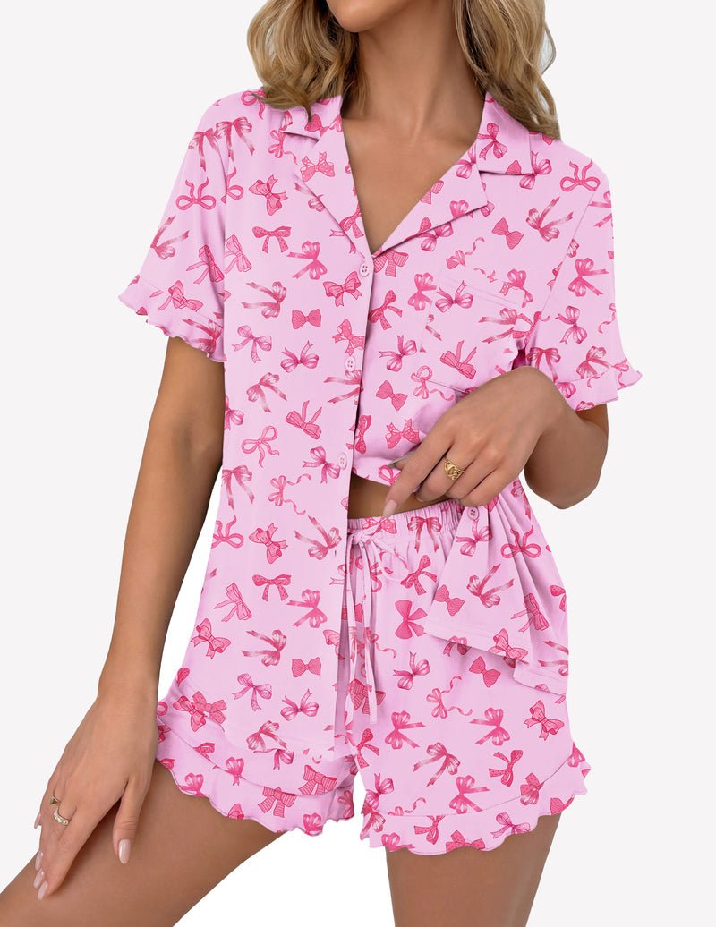 Light pink pajama set with butterfly print: button-up short sleeve top and drawstring shorts