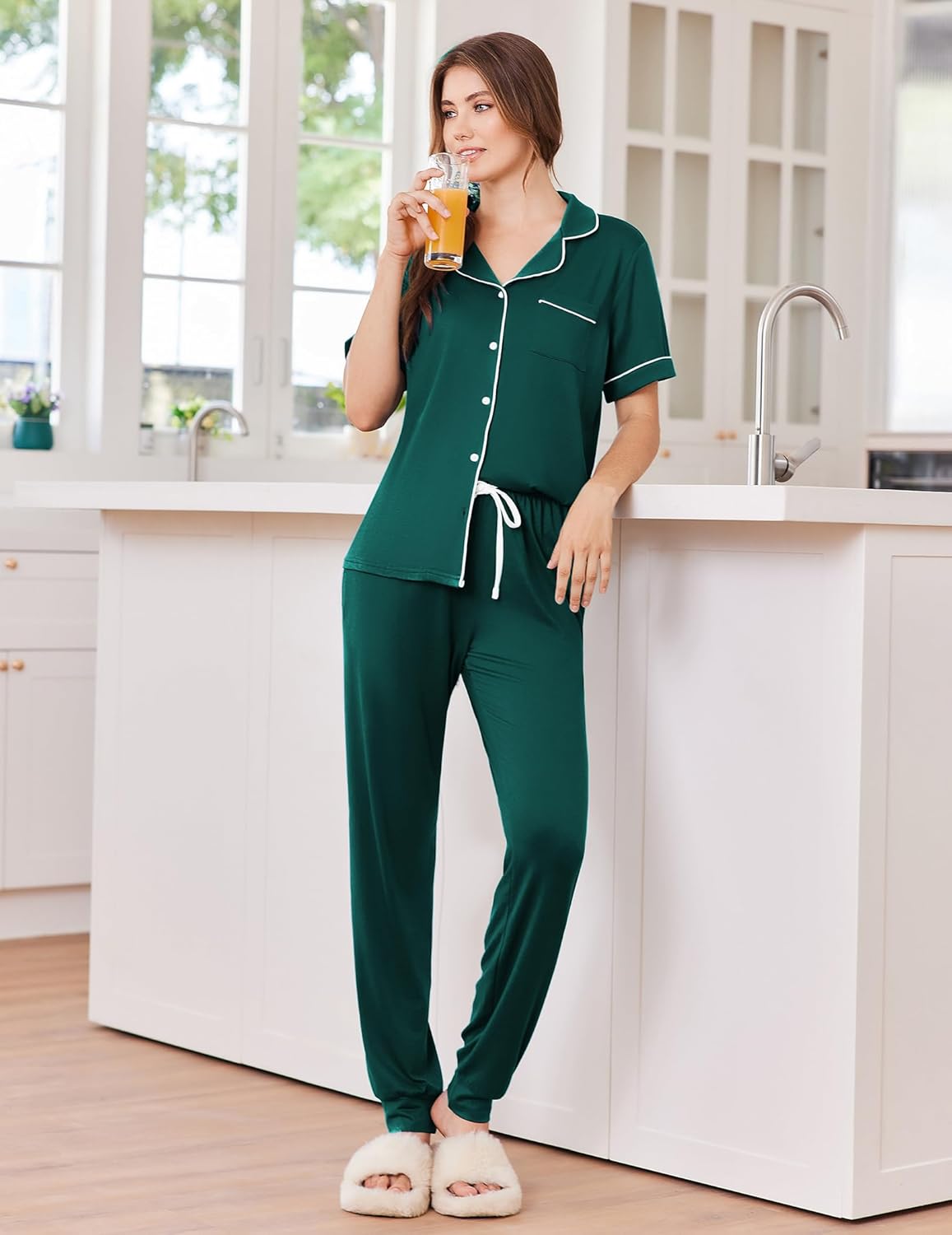 Green pajama set with button front, white-trim piping, and drawstring jogger pants
