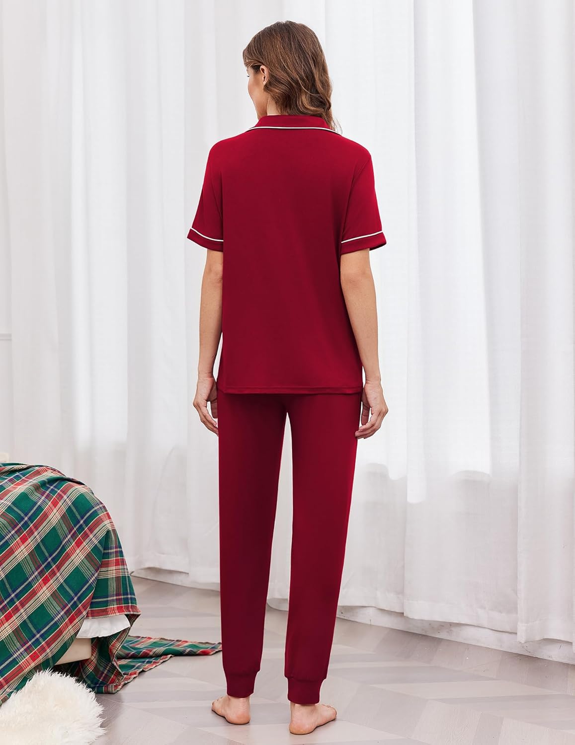 Women's back view dark red button-front pajama set with white trim and drawstring joggers