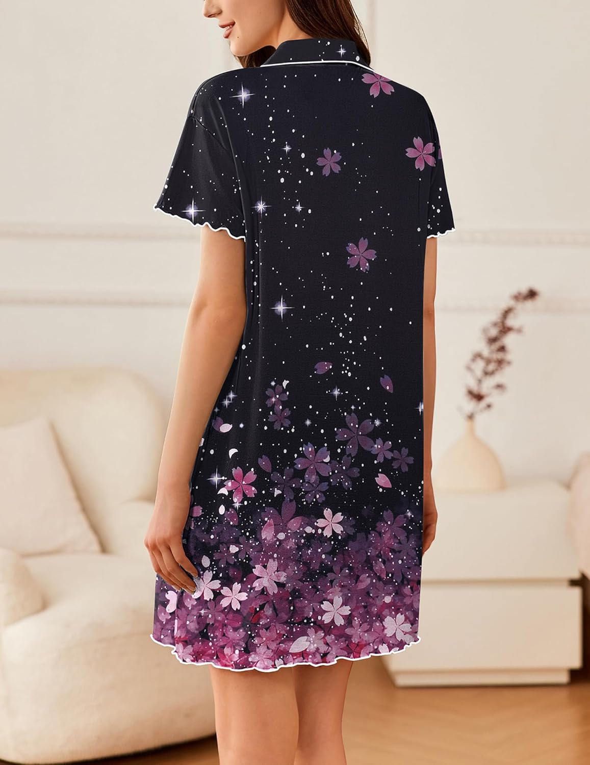Back view of dark star-print short-sleeve sleep shirt with pink floral pattern hem