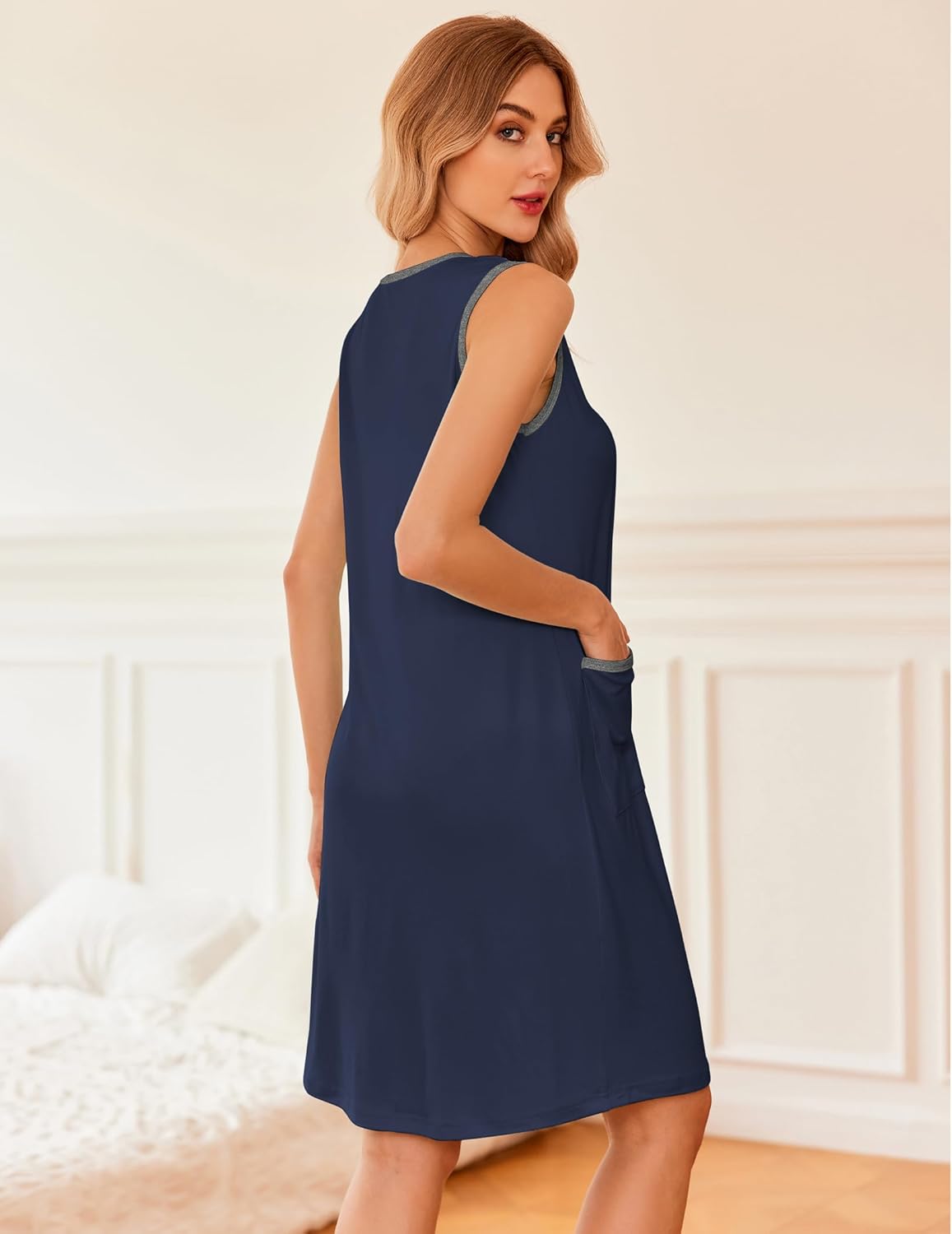 Navy blue sleeveless nightshirt with button placket and side pocket detail