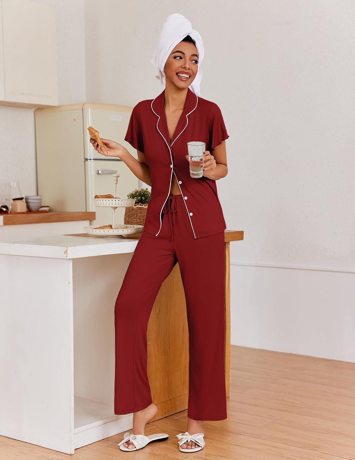 Burgundy button-up pajama set with tied waist detail and wide-leg pants