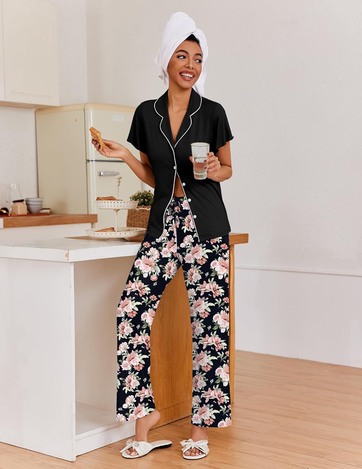 Black button-up pajama set with short sleeves and floral pants
