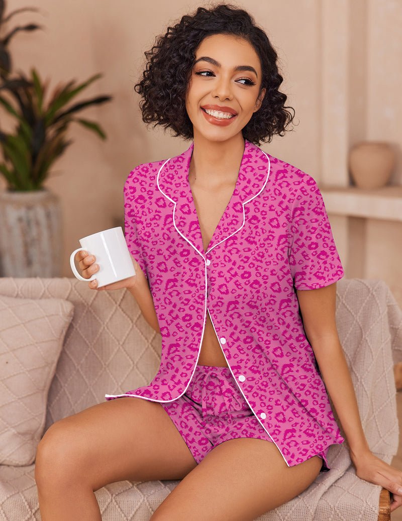 Pink leopard print pajama set with short-sleeve button-up top and matching shorts