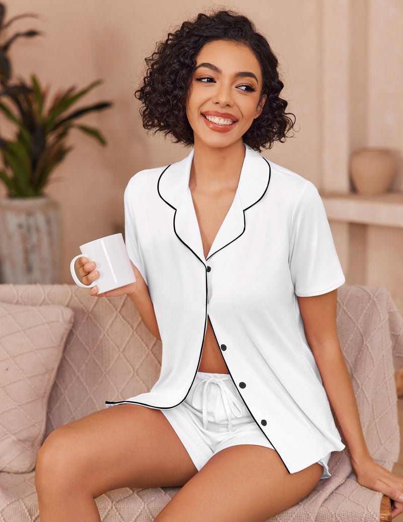 White button-up pajama set with black trim, short-sleeve top and shorts