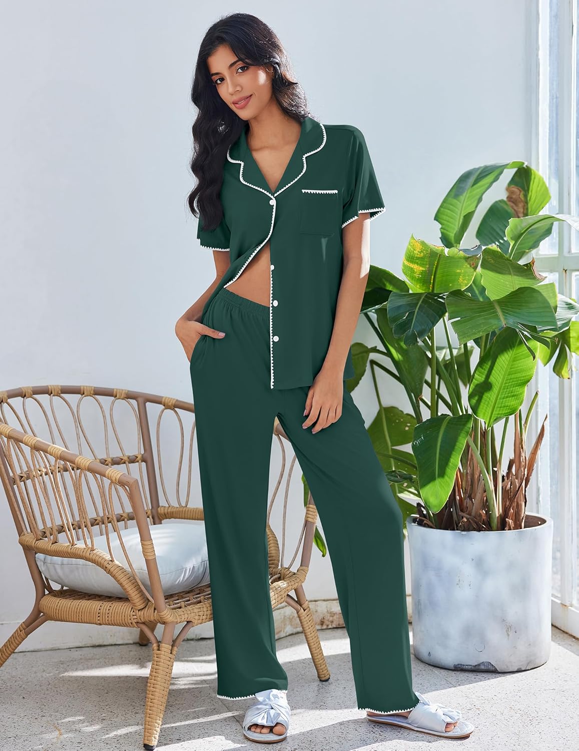 Green button-up lounge set with short sleeves, pajama pants, and white trim