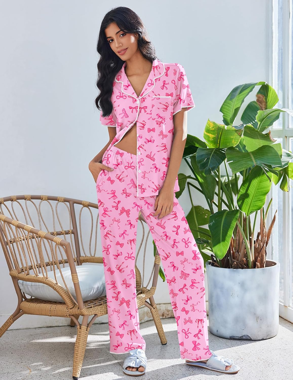 Pink bow print button-up lounge set with white trim and long matching pants