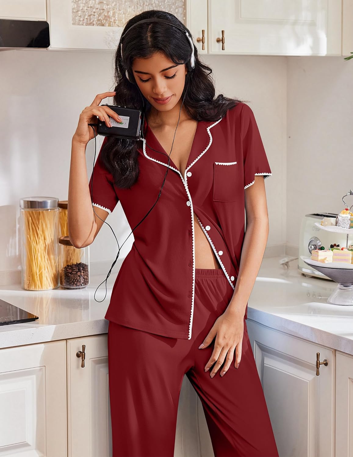 Deep red pajama set with button front top, short sleeves, and long pants with trim