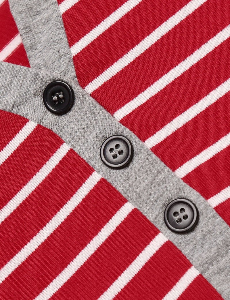 Red-and-white striped sleep shirt placket detail with three dark buttons