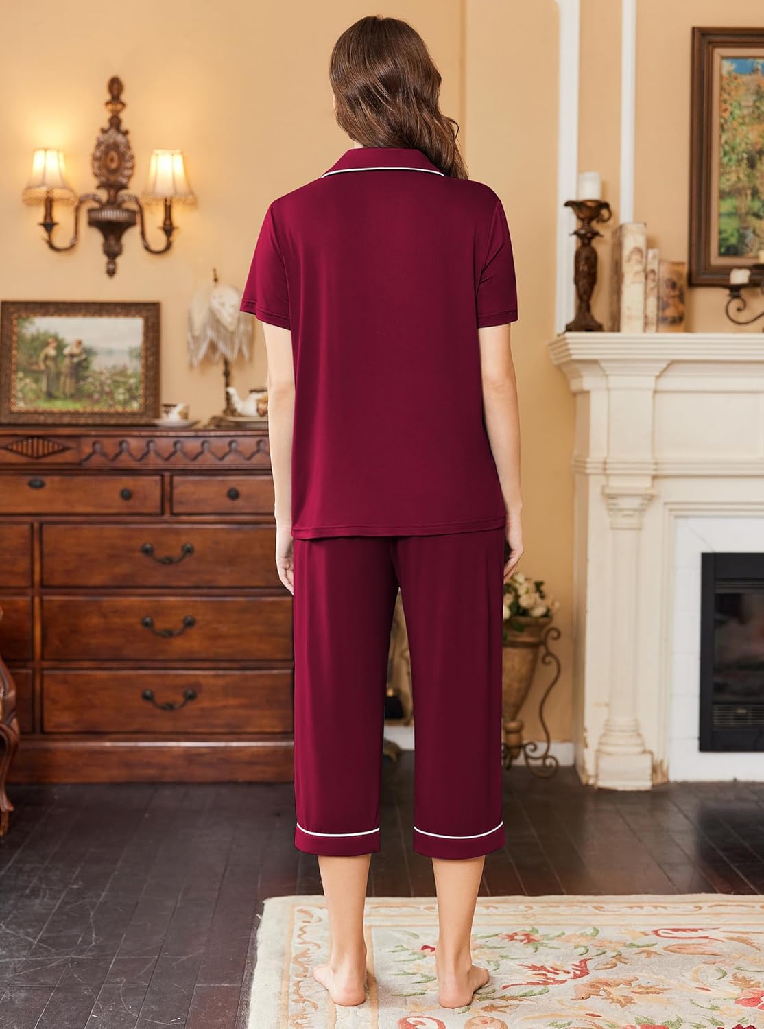 Back view: women’s burgundy short-sleeve pajama top and capri pants with white trim