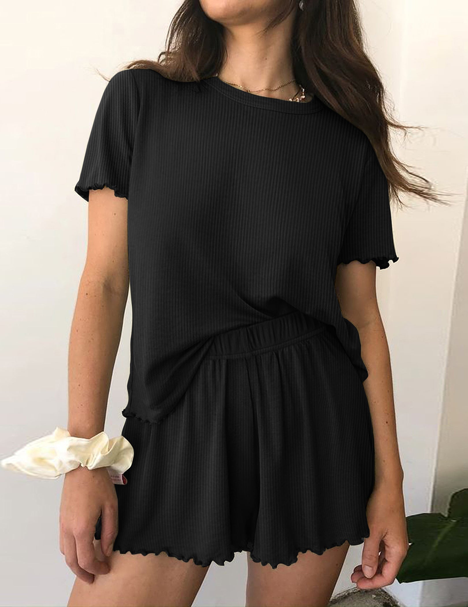 Ribbed knit pajama set in black, short-sleeve top and matching elastic-waist shorts