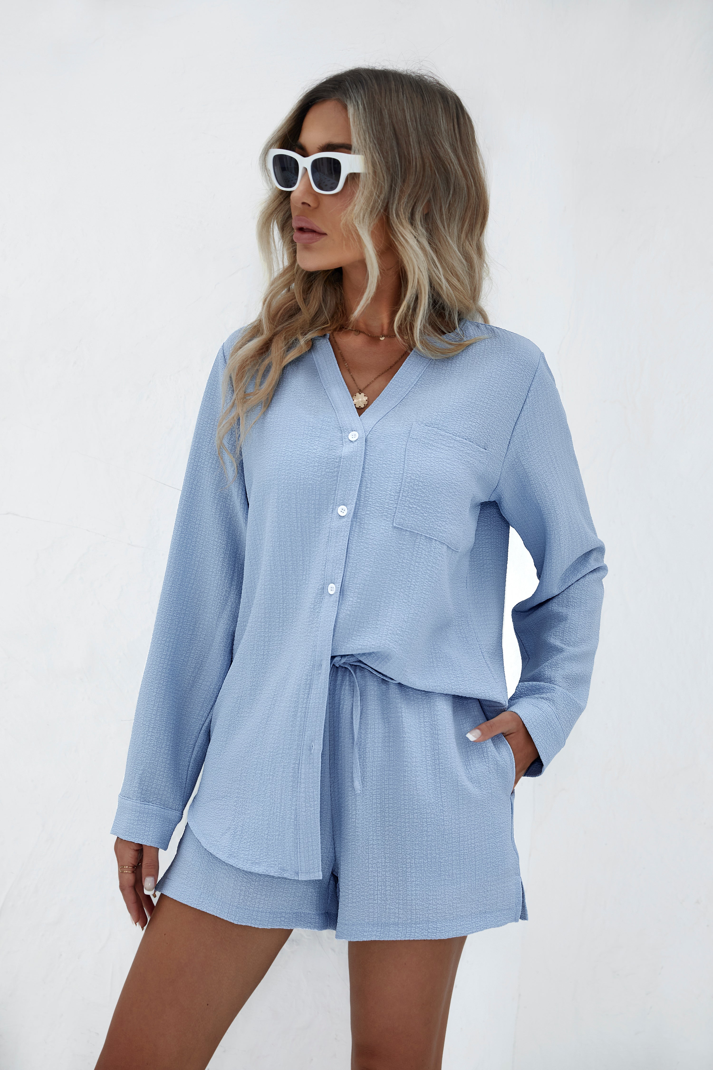 Light blue bubble crepe 2-piece set with button shirt and elastic-waist shorts