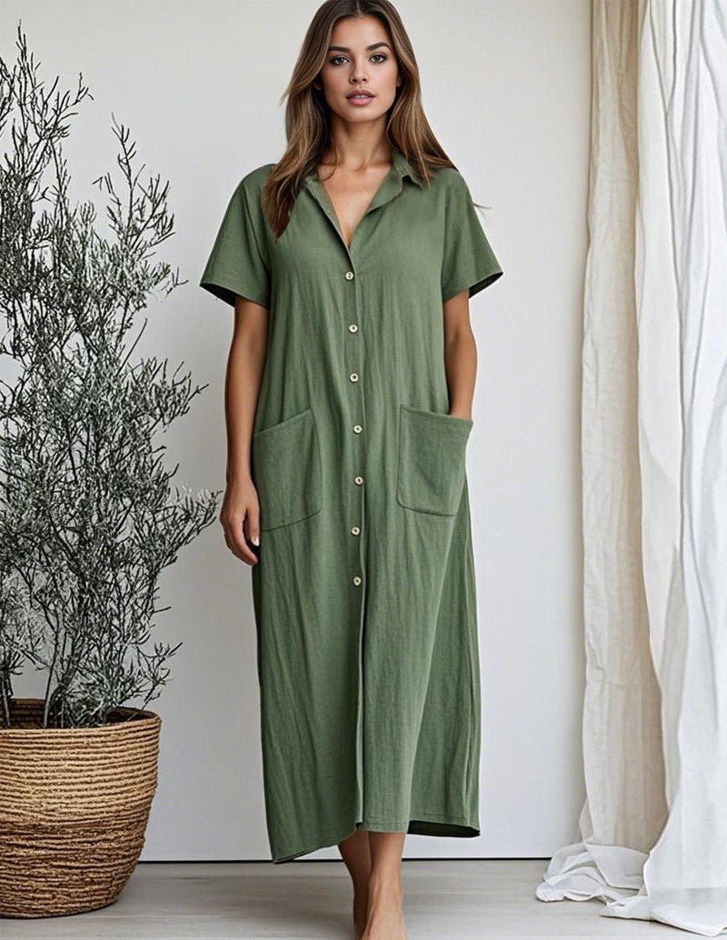 Green cotton shirt dress with short sleeves, button front, collar, and patch pockets.