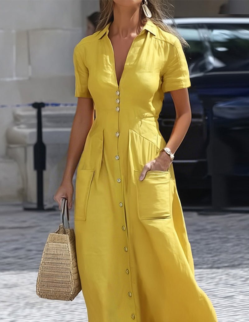 Yellow maxi shirt dress with collar, short sleeves, button-front, and side pockets.