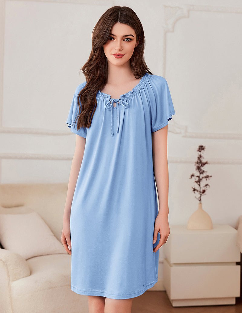 Short-sleeve dress in light blue with gathered neckline and bow-tie detail
