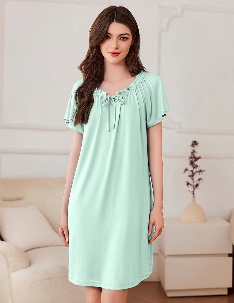 Short-sleeve dress in mint green with gathered neckline and bow-tie detail