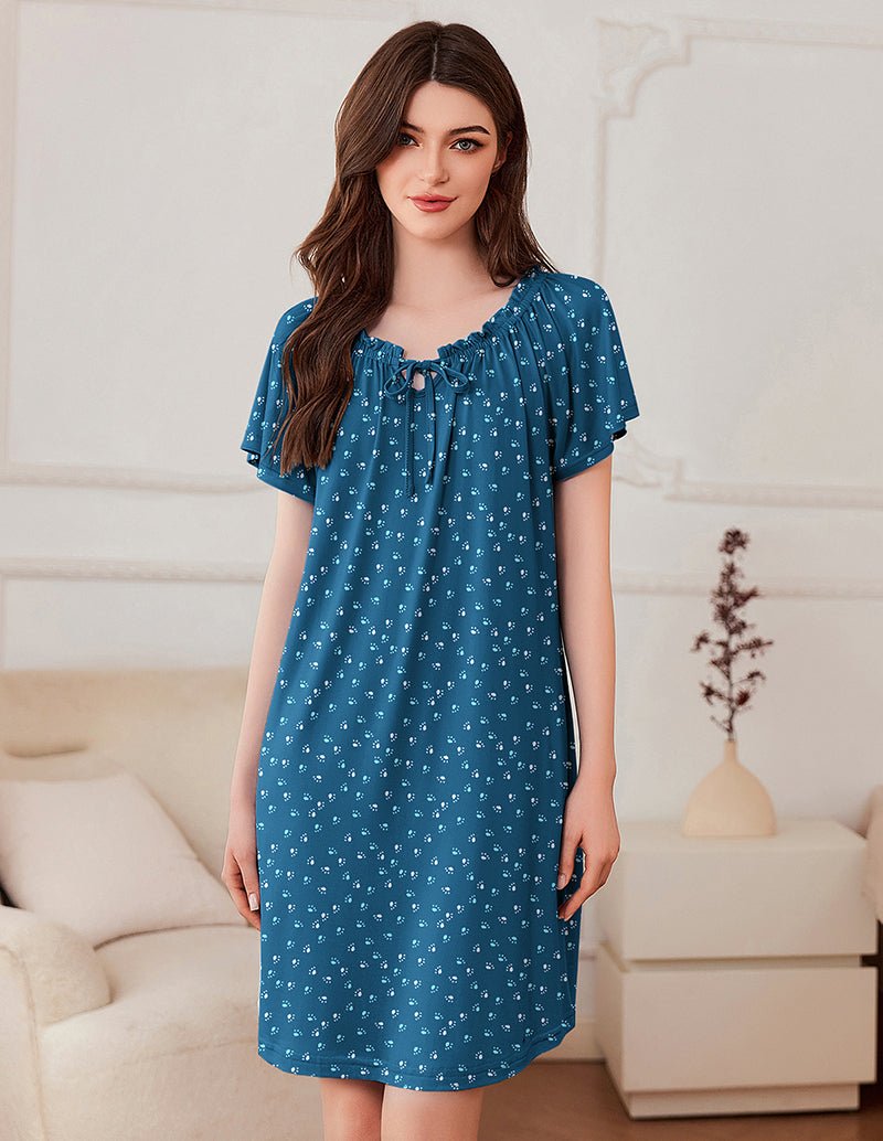 Casual short sleeve pleated dress, clear blue with small white pattern and tie neckline.