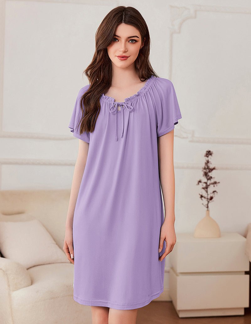 Short-sleeve dress in lavender with gathered neckline and bow-tie detail