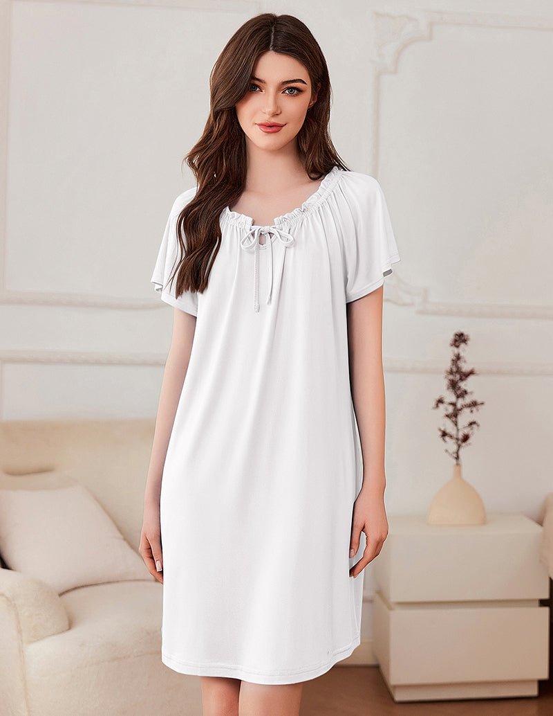 Short-sleeve dress in white with gathered neckline and bow-tie detail
