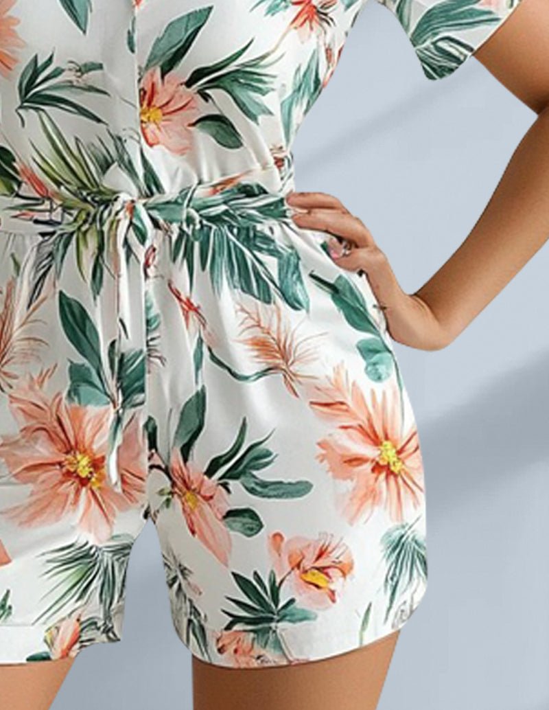 Floral pajama romper with short sleeves, button-front, and tied waist