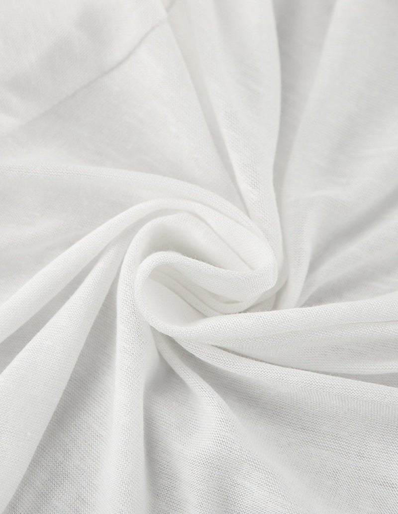 White pajama fabric close-up with soft knit texture