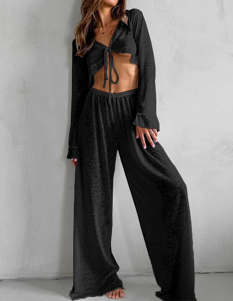 Black lightweight two-piece pajama set with tie-front long-sleeve top and wide-leg pants