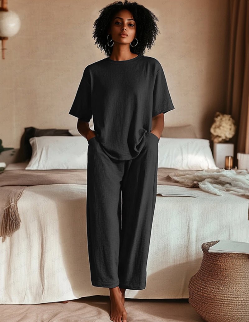 Two-piece pajama set in black: short-sleeve top and wide-leg pants
