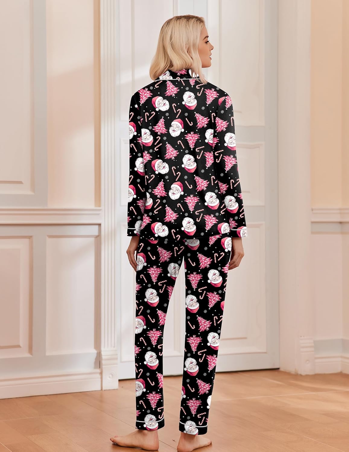 Black Christmas pajama set with long sleeves and pants, pink tree-and-snowman prints